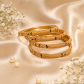 Traditional Four-Piece Intricate Gold Bangle Set with Meenakari Accents